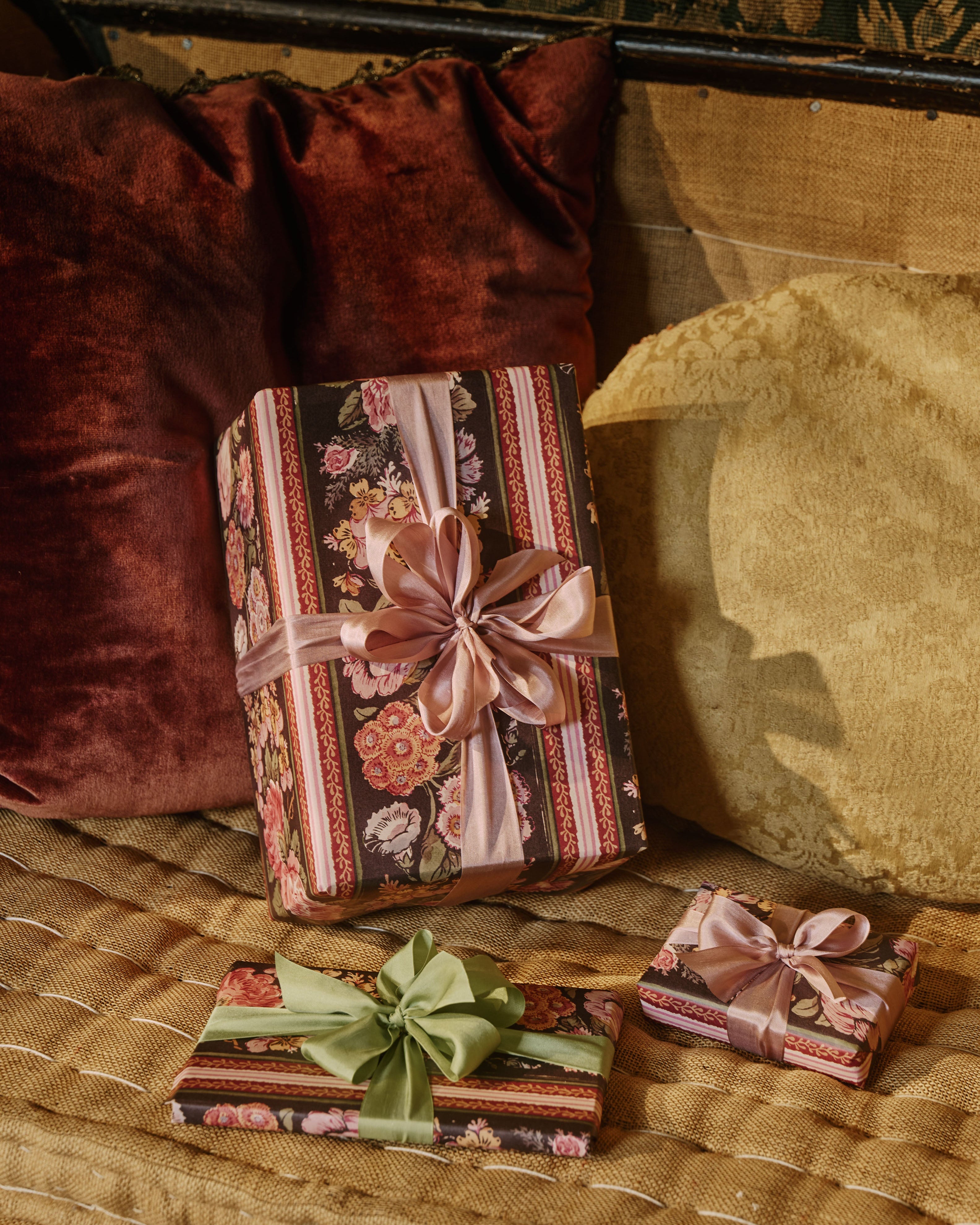 Gifts wrapped in The Kensington Paperie wrapping paper with silk ribbon.