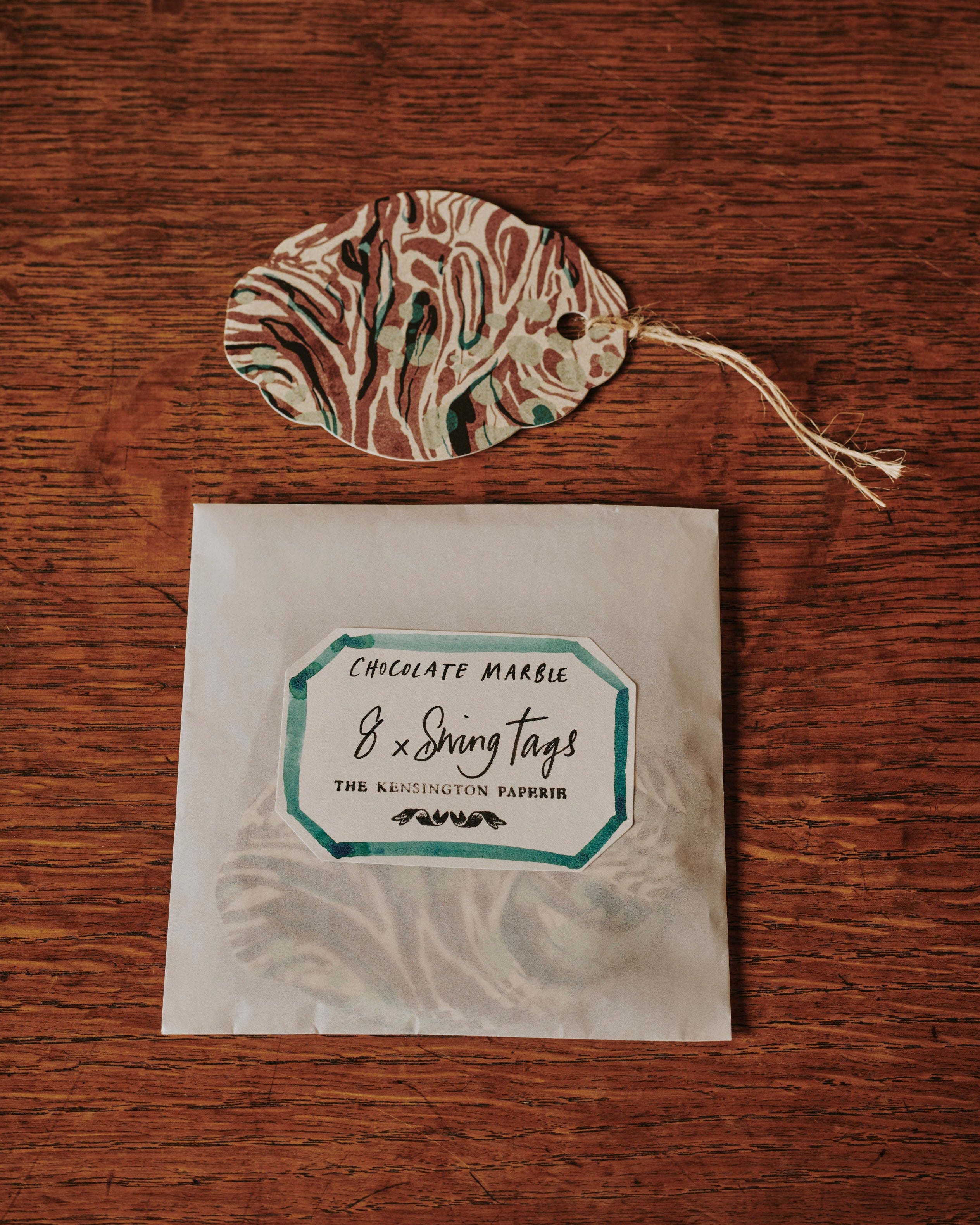a shot of the Kensington Paperie marble chocolate swing tag product
